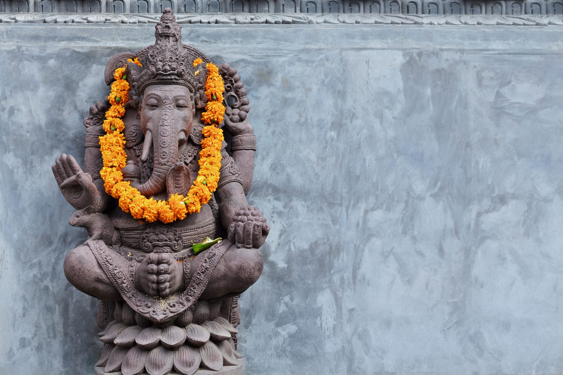 Ganesha statue with marigolds at Jyotirmaya Yoga Kendra