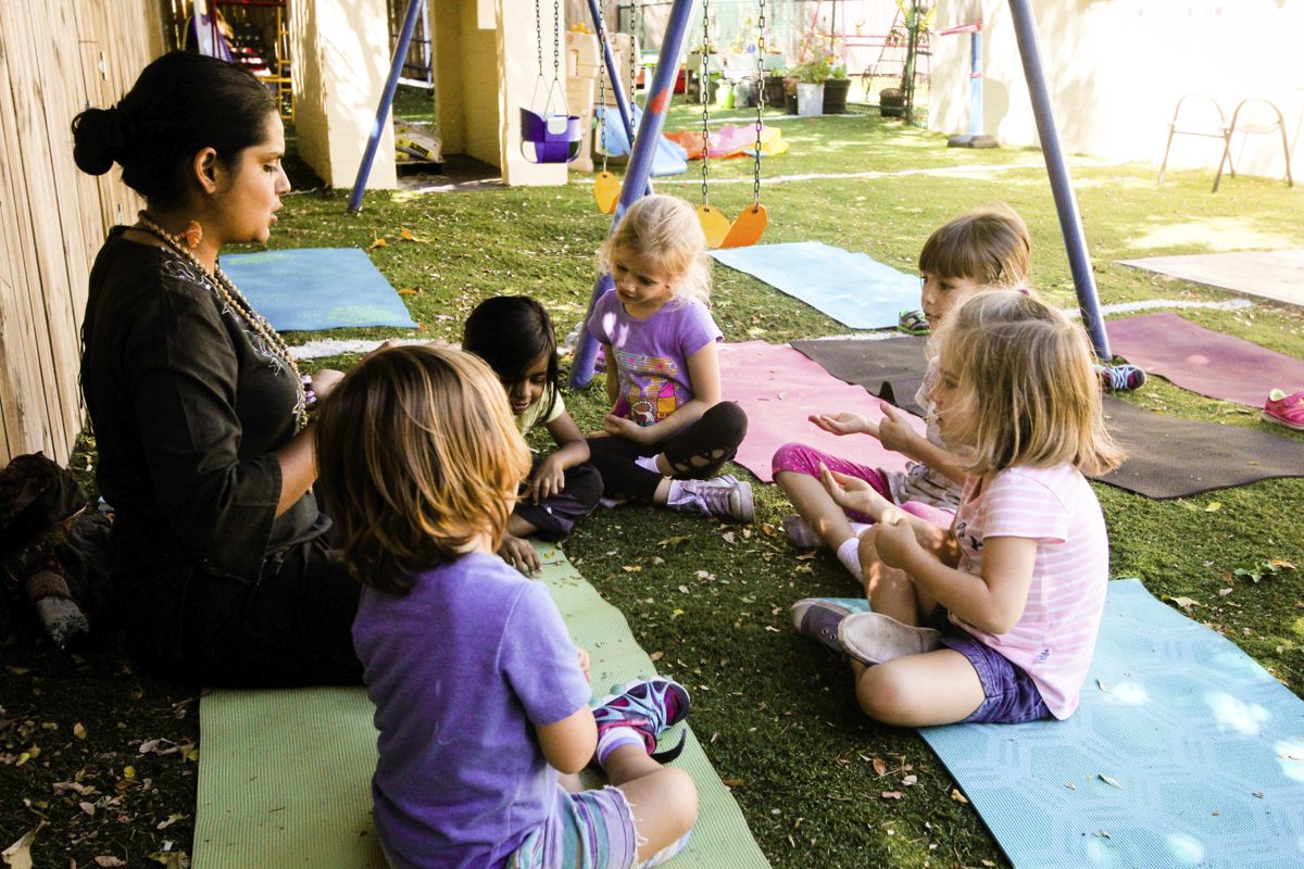 Vaani leading a kids yoga circle